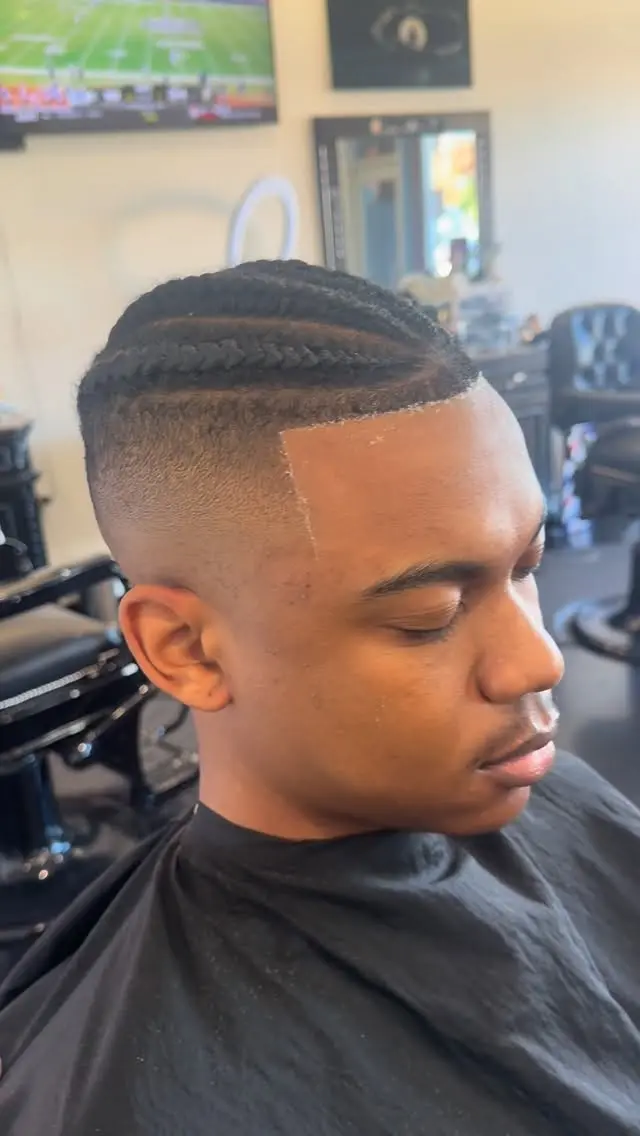 High fade with braids on top, cut at Ocean Park Barbershop