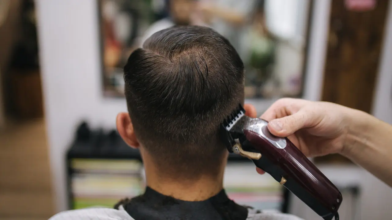 Clippers finishing the back of a short haircut
