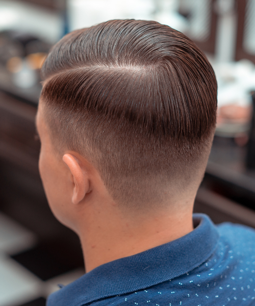 A man with a short haircut in a barbershop